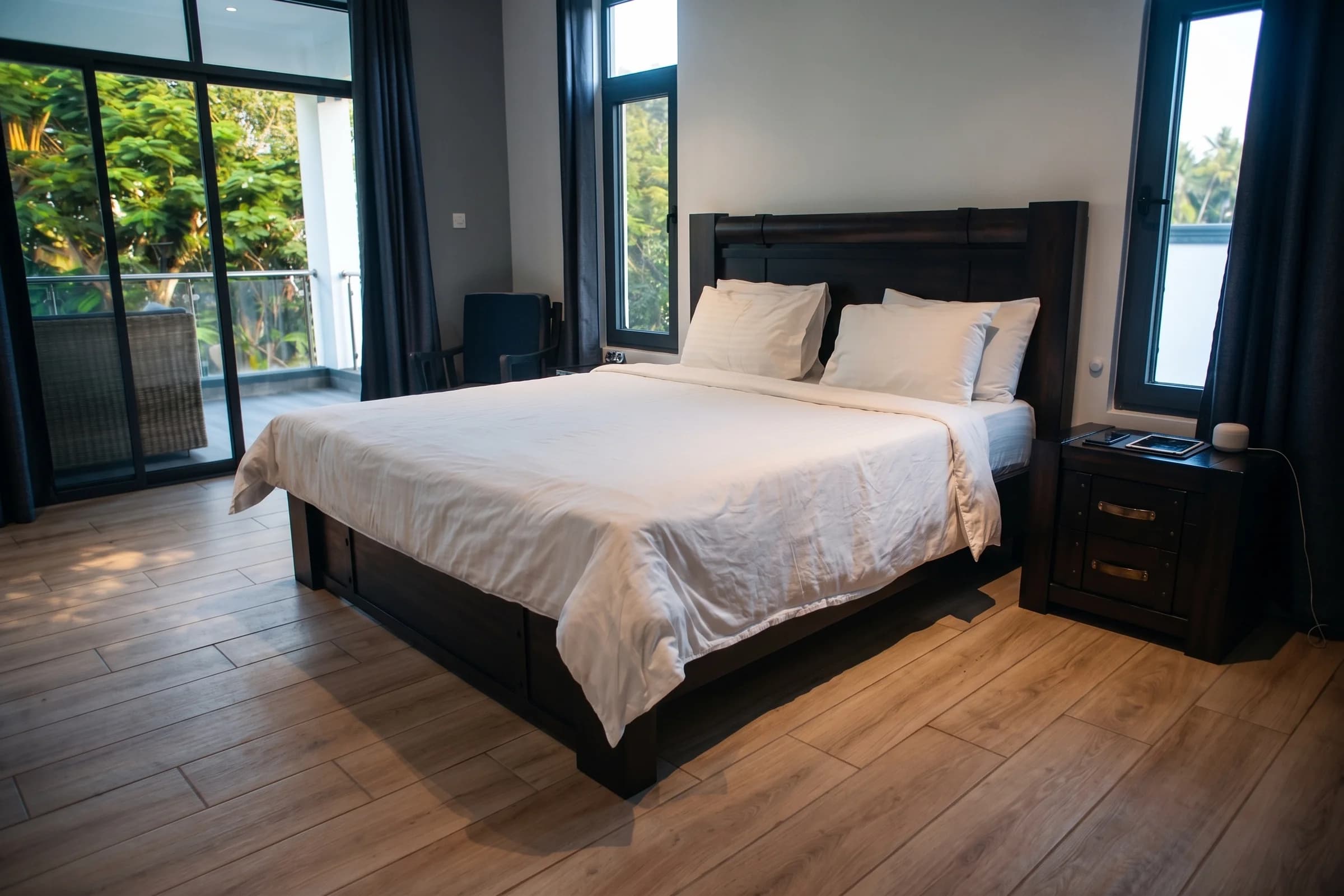 Deluxe second bedroom on the first floor with plush king bed, en-suite bathroom, and garden outlooks