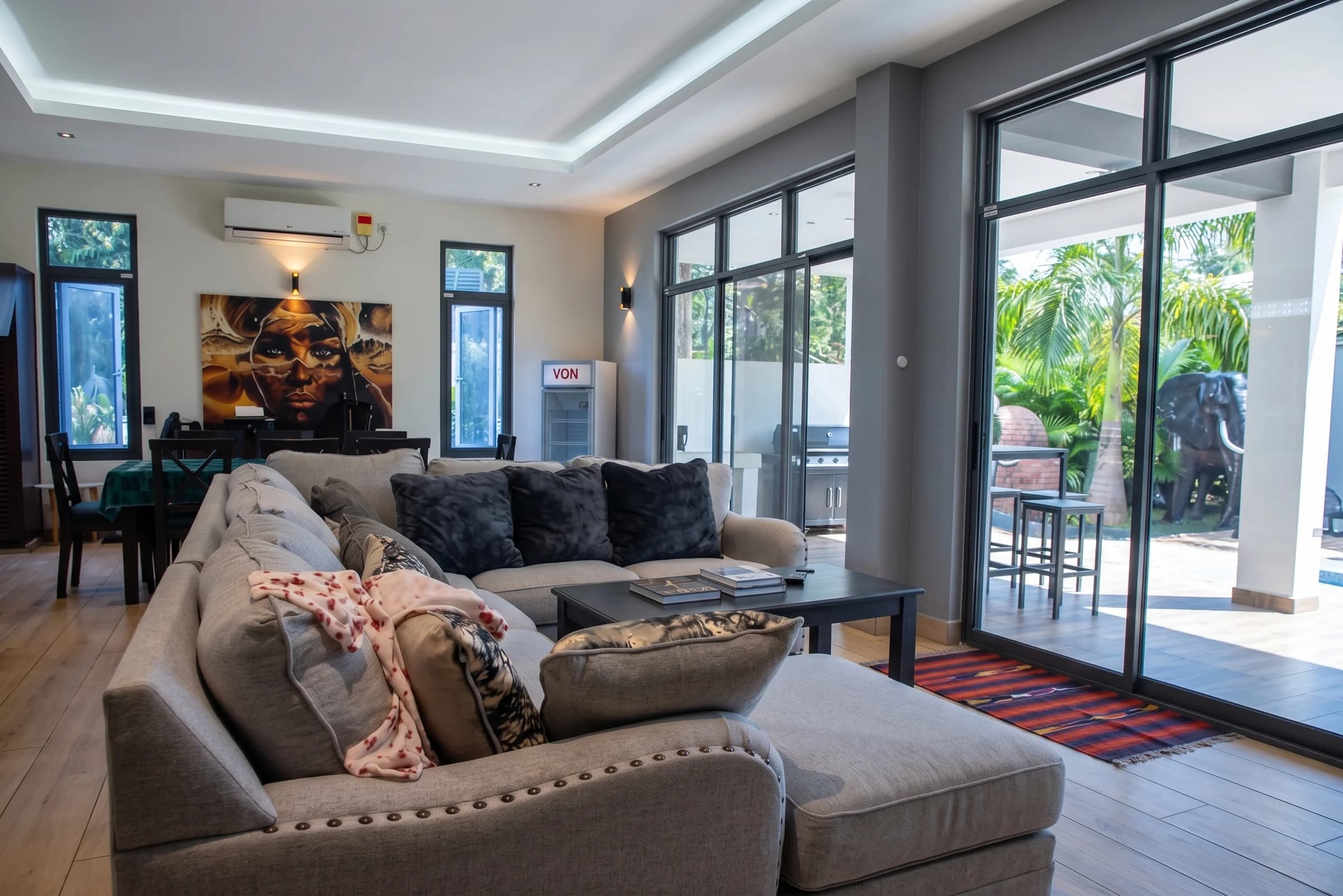 Ground floor grand living room with Swahili woodwork and plush seating at The Coastal Estate