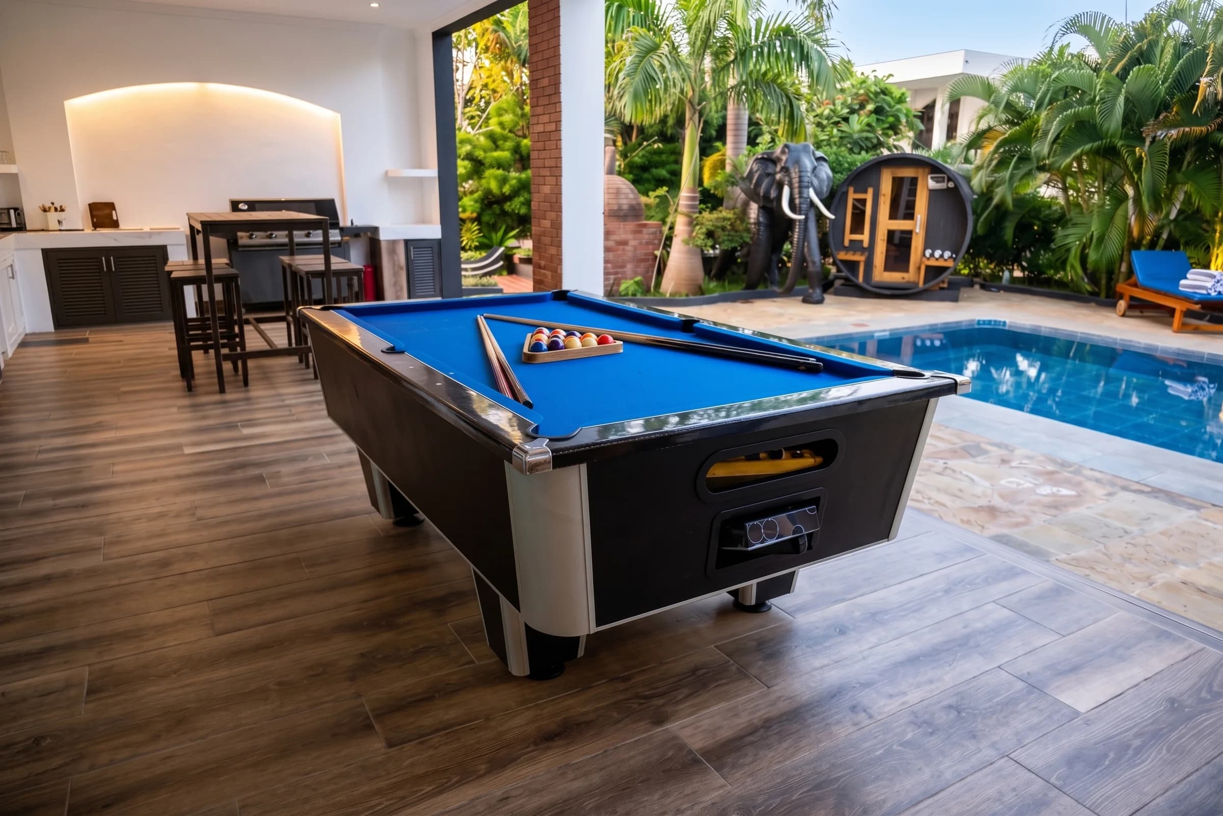 Outdoor billiards pool table on the shaded covered patio lounge at The Coastal Estate Diani Beach