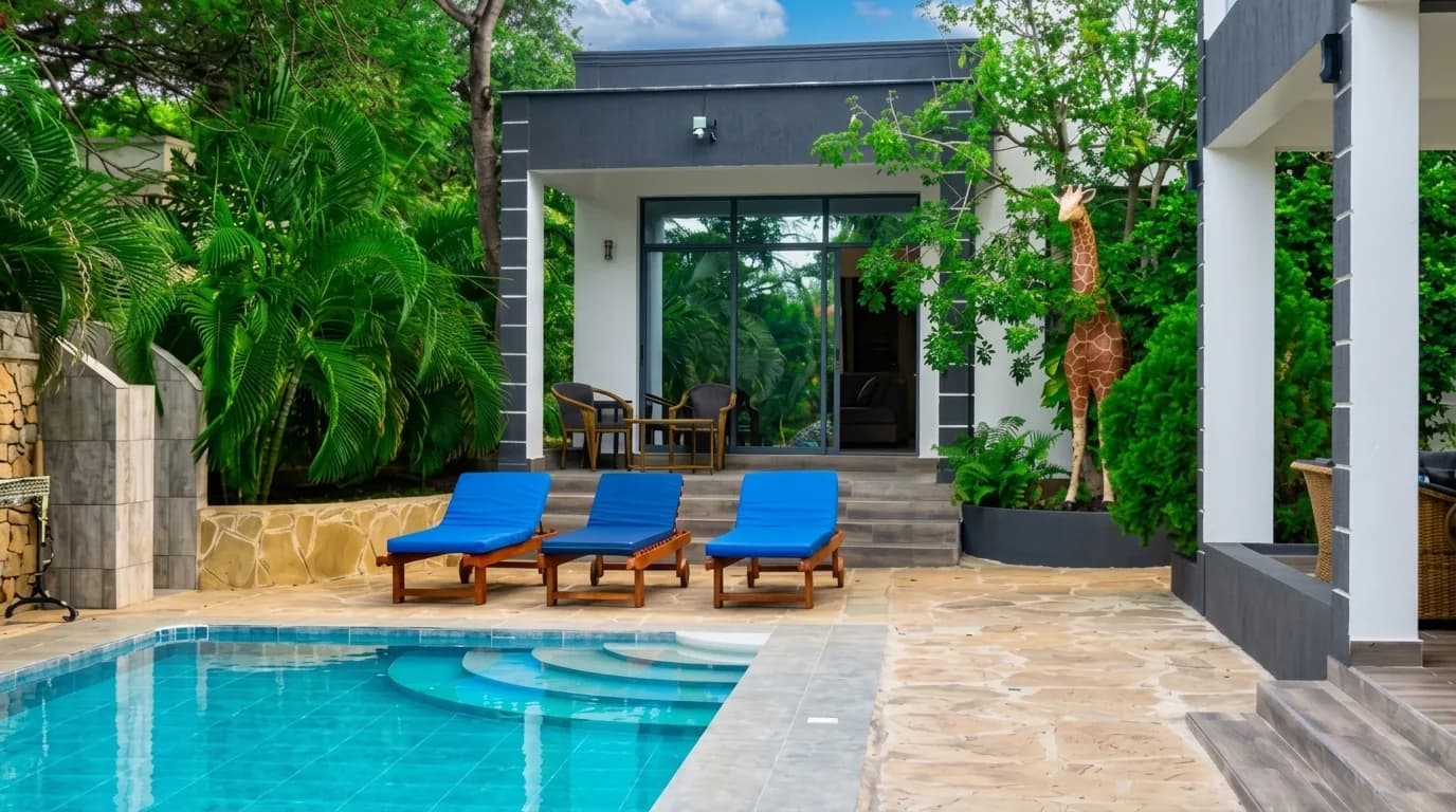 Detached garden cottage with private terrace in tropical courtyard at The Coastal Estate